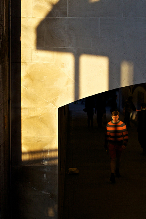 Caught by the shadows in a stripey top, Bankside, London.